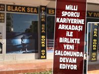 Milli sporcu kariyerine arkadaşı ile birlikte yeni salonunda devam ediyor