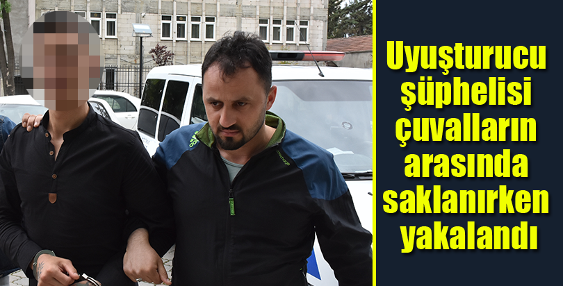 Uyuşturucu şüphelisi çuvalların arasında saklanırken yakalandı
