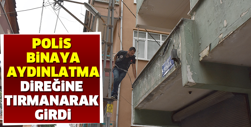 Polis binaya aydınlatma direğine tırmanarak girdi