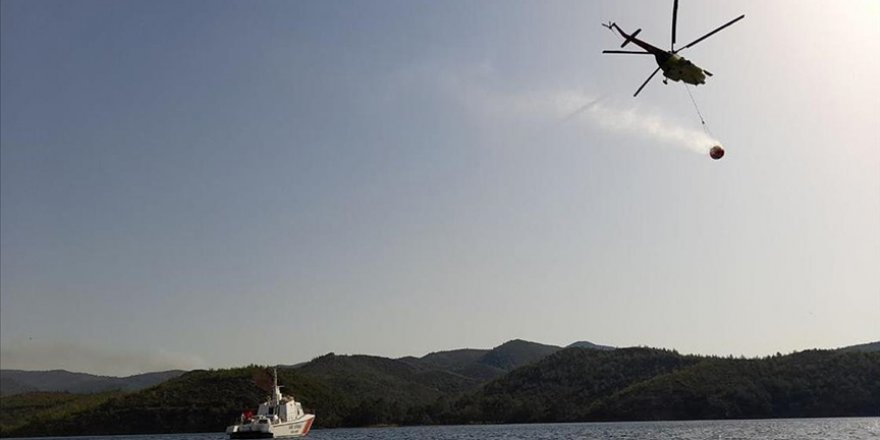 MARMARİS'TE YANAN ORMANLIK ALANDA SOĞUTMA ÇALIŞMALARI SÜRÜYOR