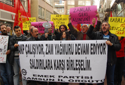 İşçi tulumuyla zamları protesto etti